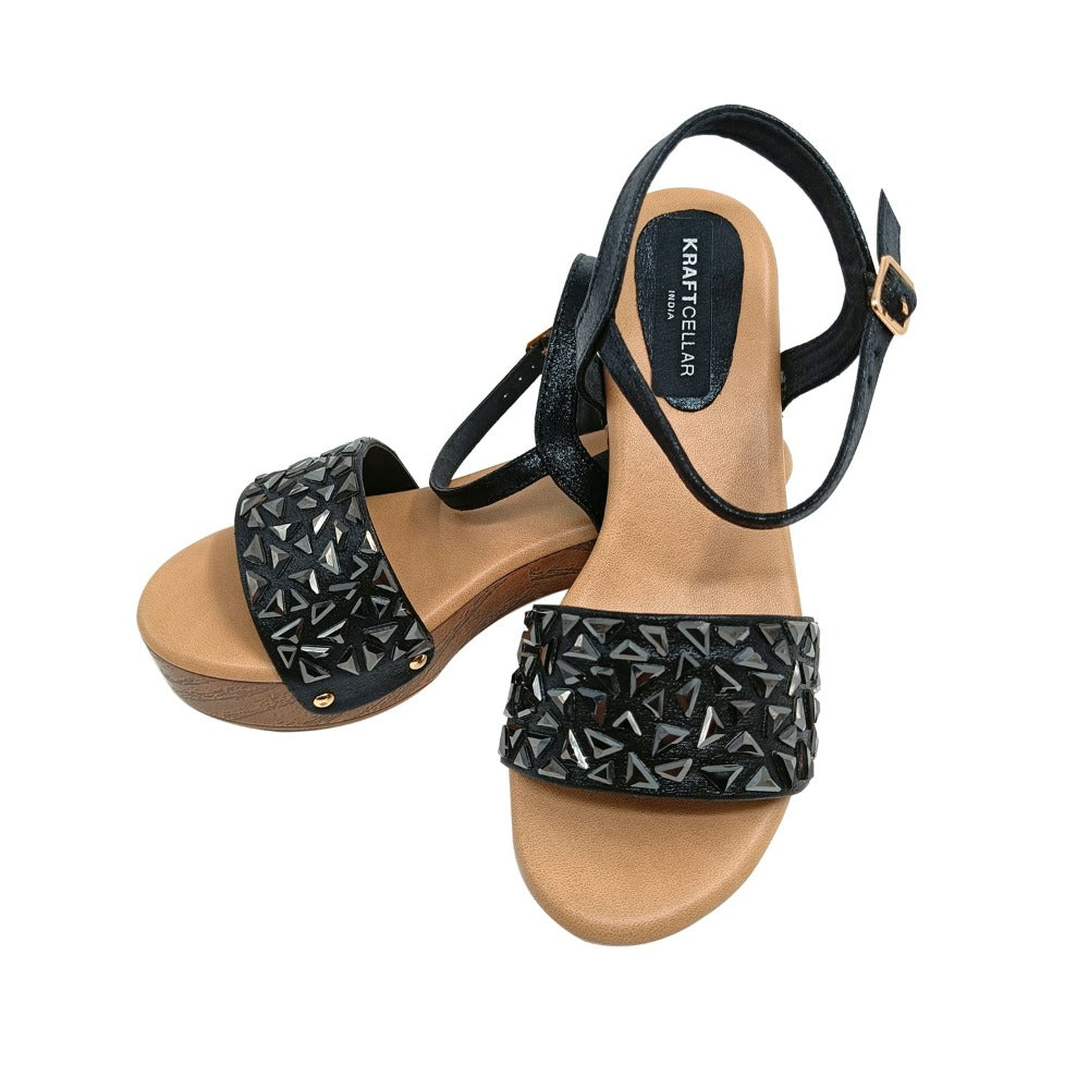 Bring trend and comfort both at its best with these crystal embellished low block heels of 2inch. Color black.